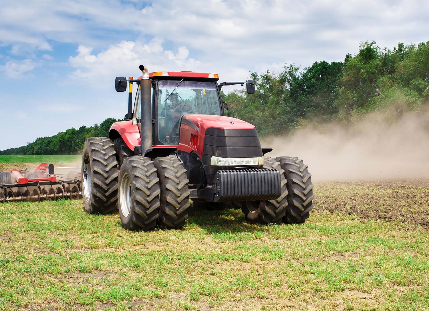 tractor pulling a disk