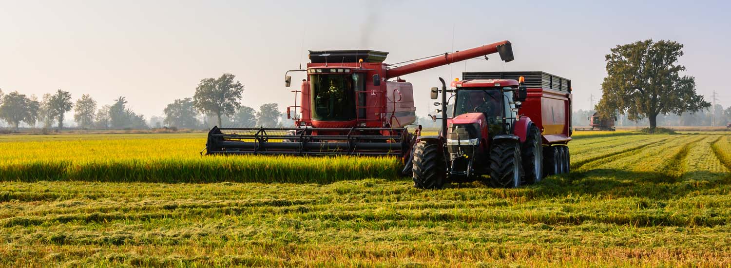 combine and grain cart in a field